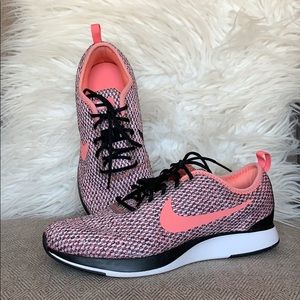 black nike with pink tick